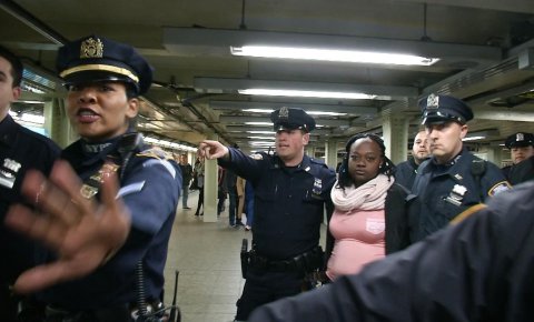 New York City police arrest a woman after a commuter was pushed in front of a subway train as it arrived at a Times Square train platform in New York, New York, in this still image from video taken November 7, 2016.  REUTERS/James Carman
