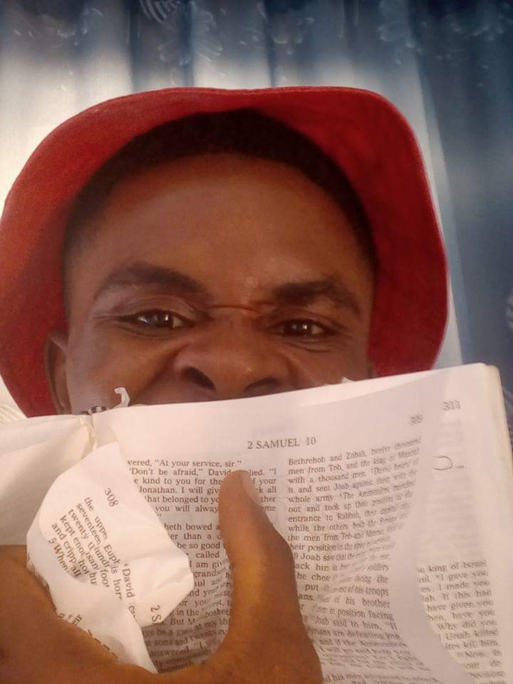  Man Tears Copy Of The Bible After A Catholic Priest Destroyed A Shrine In His Community In Anambra