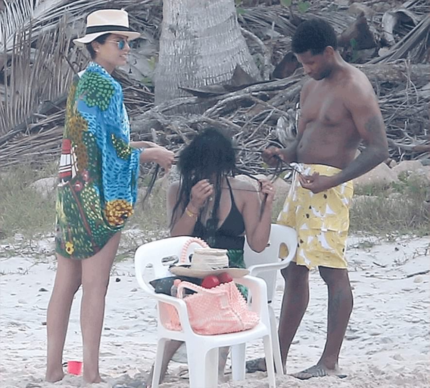 Usher Photo’d Helping His Wife Take Out Her Weave On At The Beach