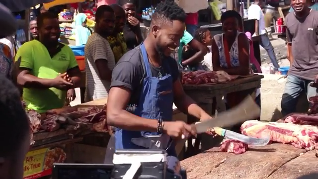 Adekunle Gold Turns Butcher While Shooting WORK Video 2