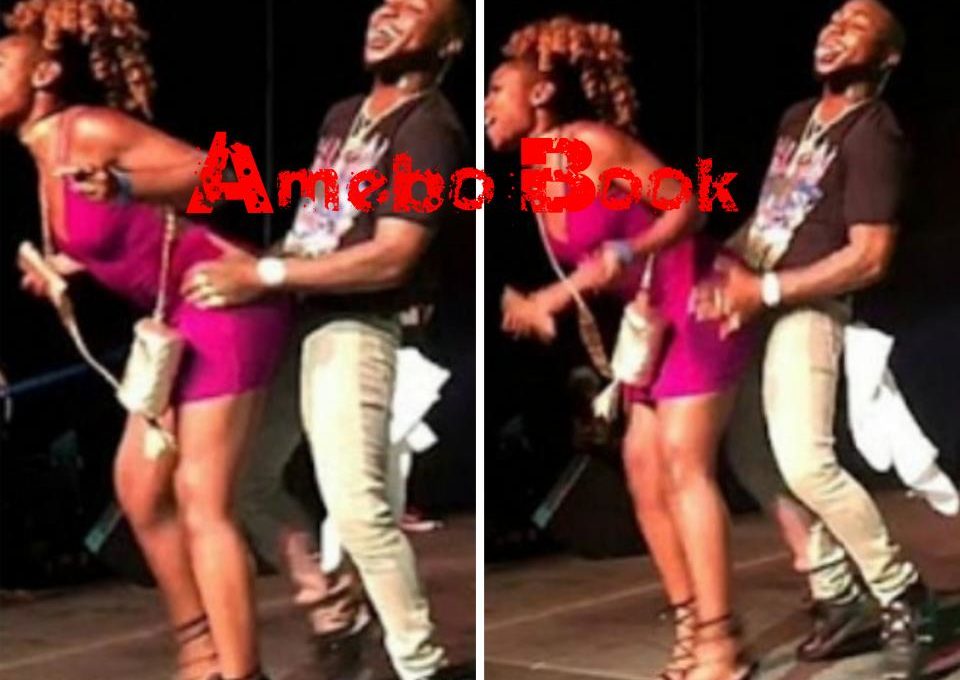Davido And His Facial Expression As Lady Grinds Him While On Stage