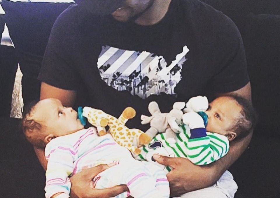 Paul Psquare Carrying His Twins