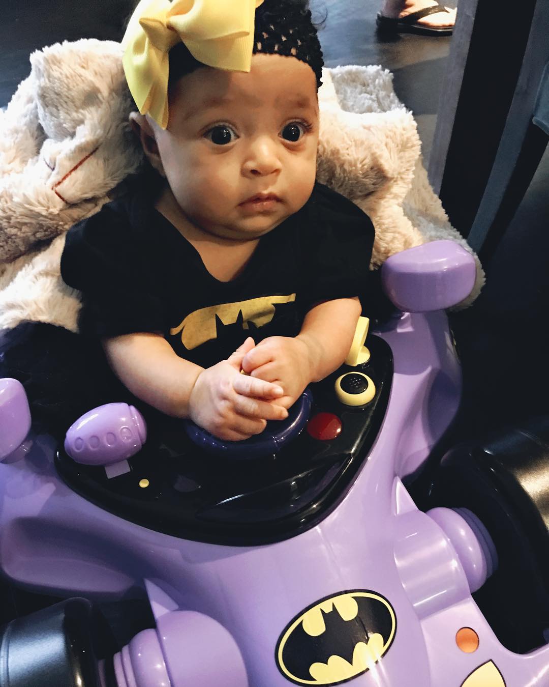 Alexis Olympia dressed up as a superhero in her first Halloween