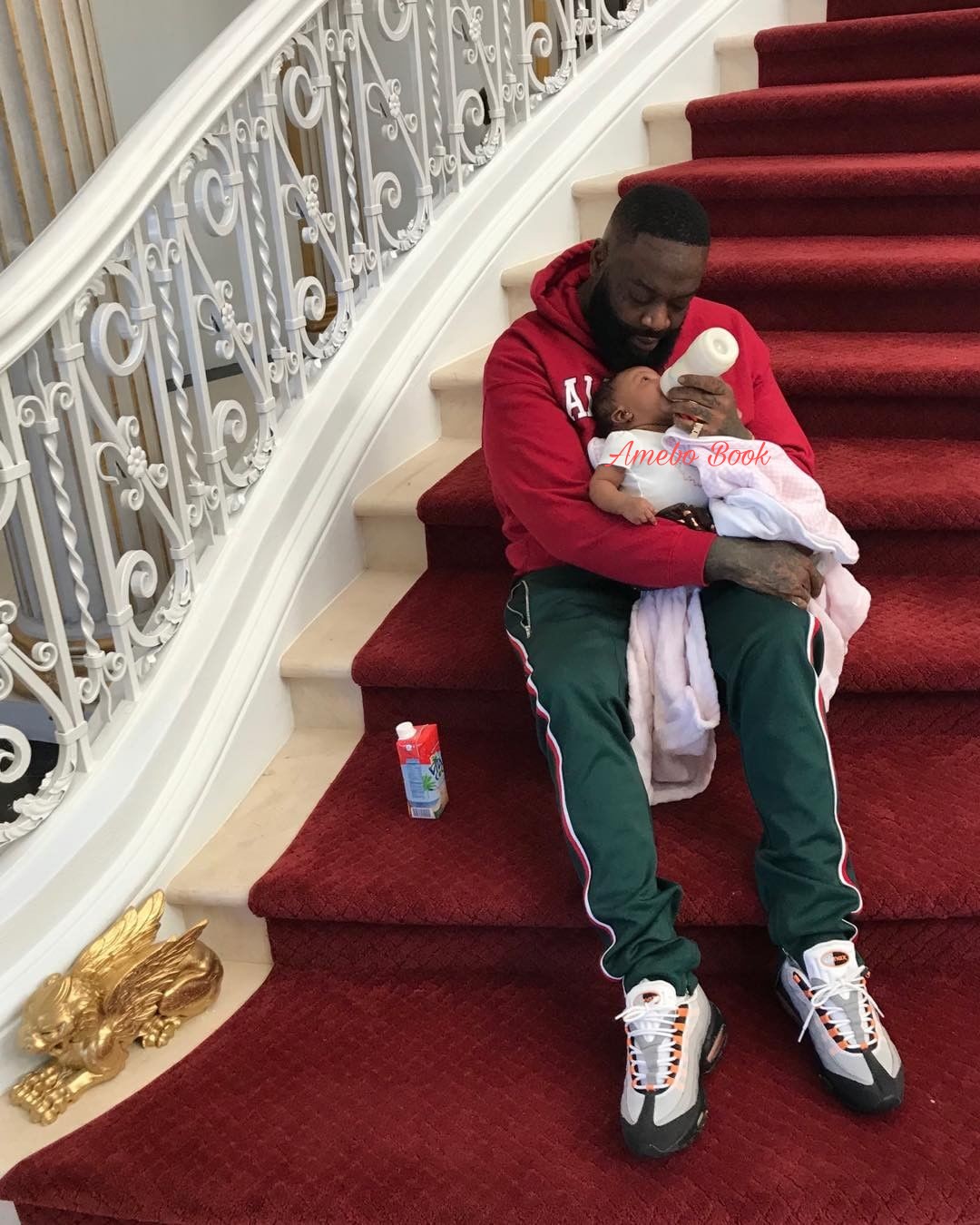 Rick Ross Bottle Feeding His Daughter (2)