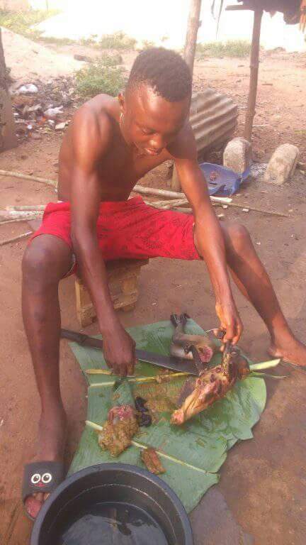 Nigerian Man Pictured Slaughtering Roasted Monkey He Just Killed In Rivers State (5)