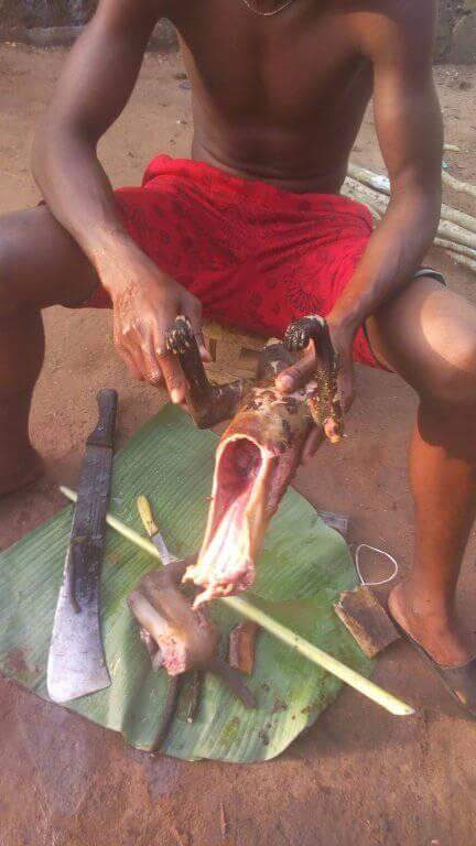 Nigerian Man Pictured Slaughtering Roasted Monkey He Just Killed In Rivers State (6)