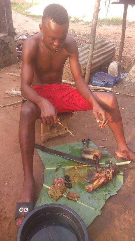 Nigerian Man Pictured Slaughtering Roasted Monkey He Just Killed In Rivers State (7)