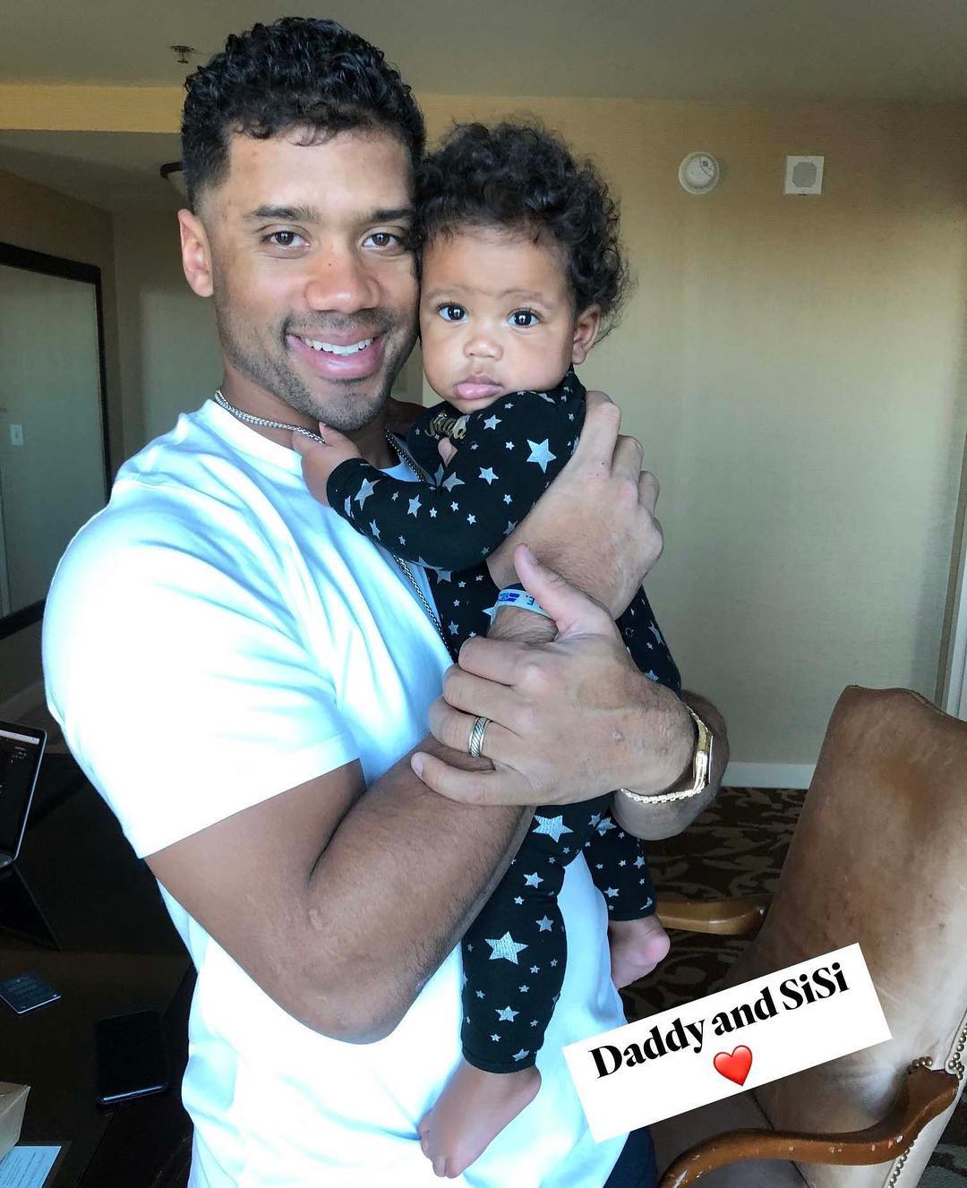 Russell Wilson Holding Their Baby Girl Sienna (2)