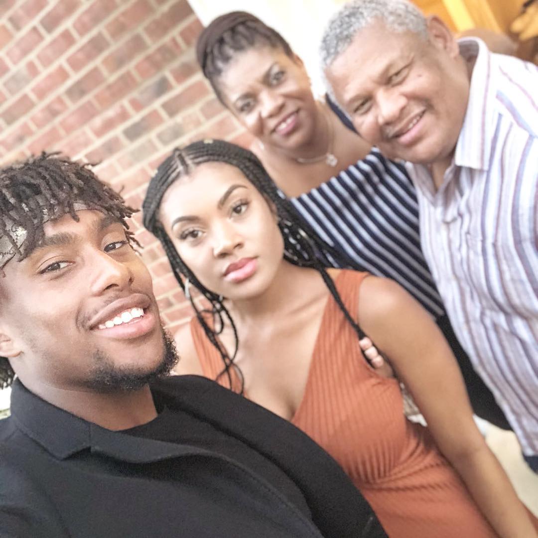 Alex Iwobi Poses With His Parents And Sister