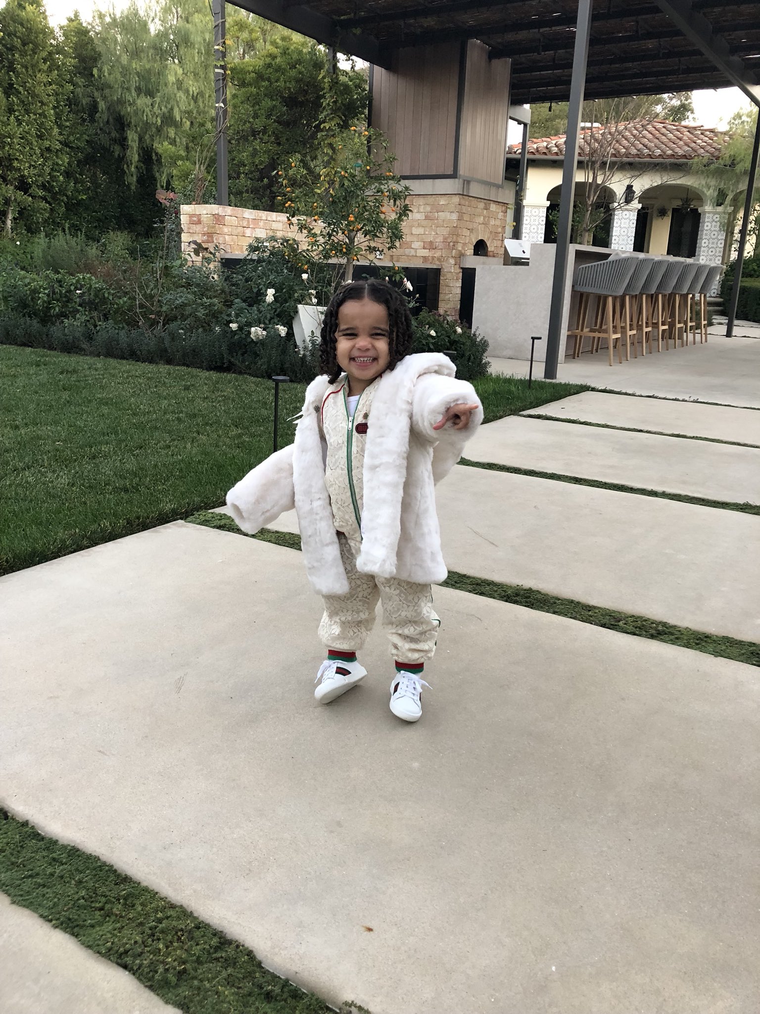Dream Kardashian Flashes Big Smile In Gucci Onesie (2)