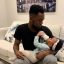 Patoranking Bottle-feeding His Daughter