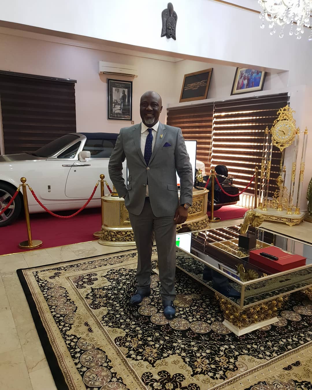 Dino Melaye Posing With His Rolls Royce In Living Room