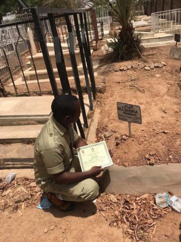 Nigerian Man Presents His NYSC Certificate To Late Mum At Grave (2)